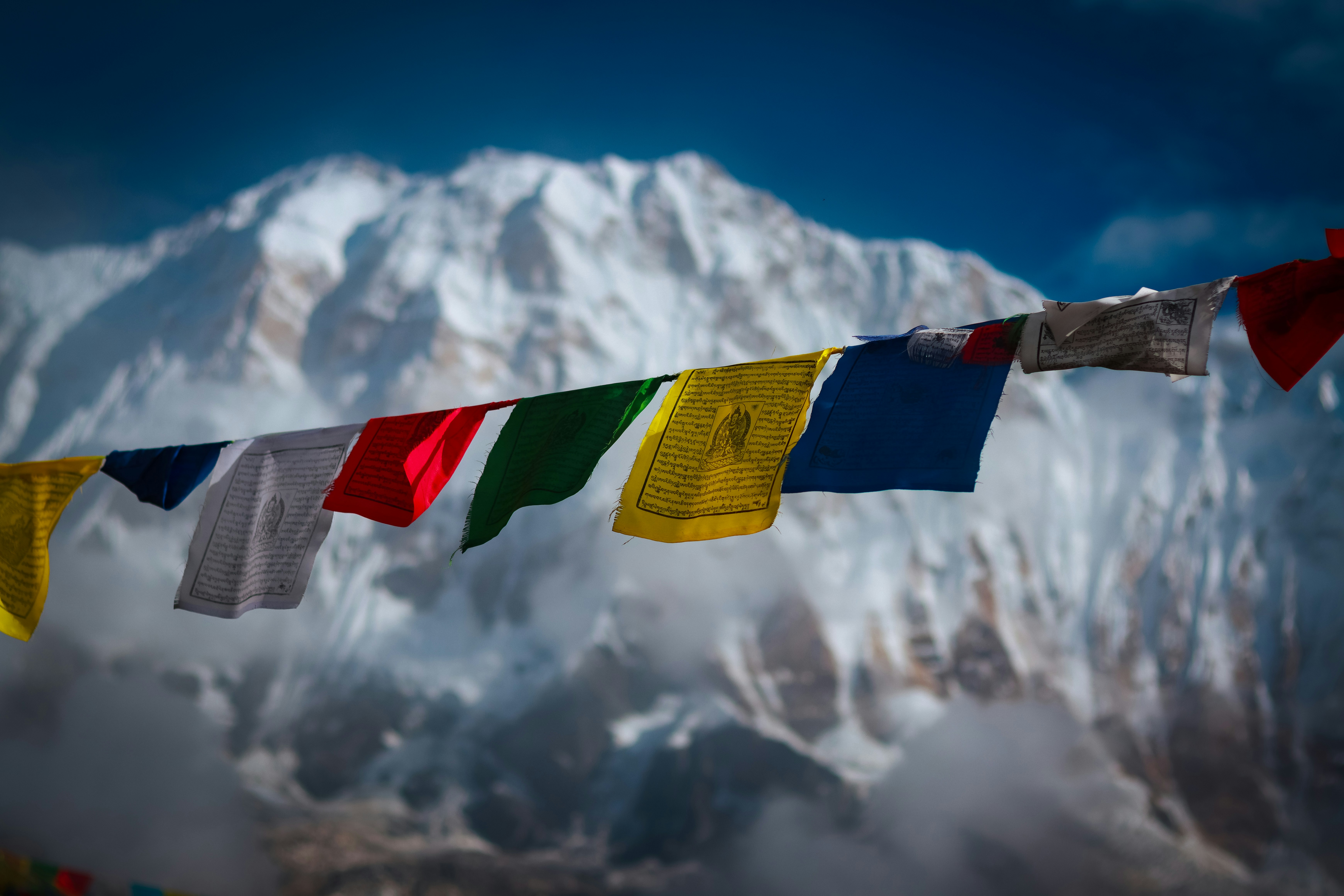Trekkers walking a Himalayan trail in Nepal during early light